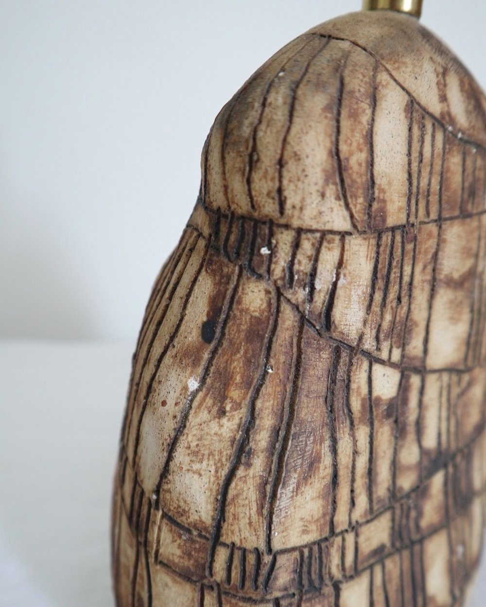 Organic shaped studio pottery table lamp with etched line decoration.