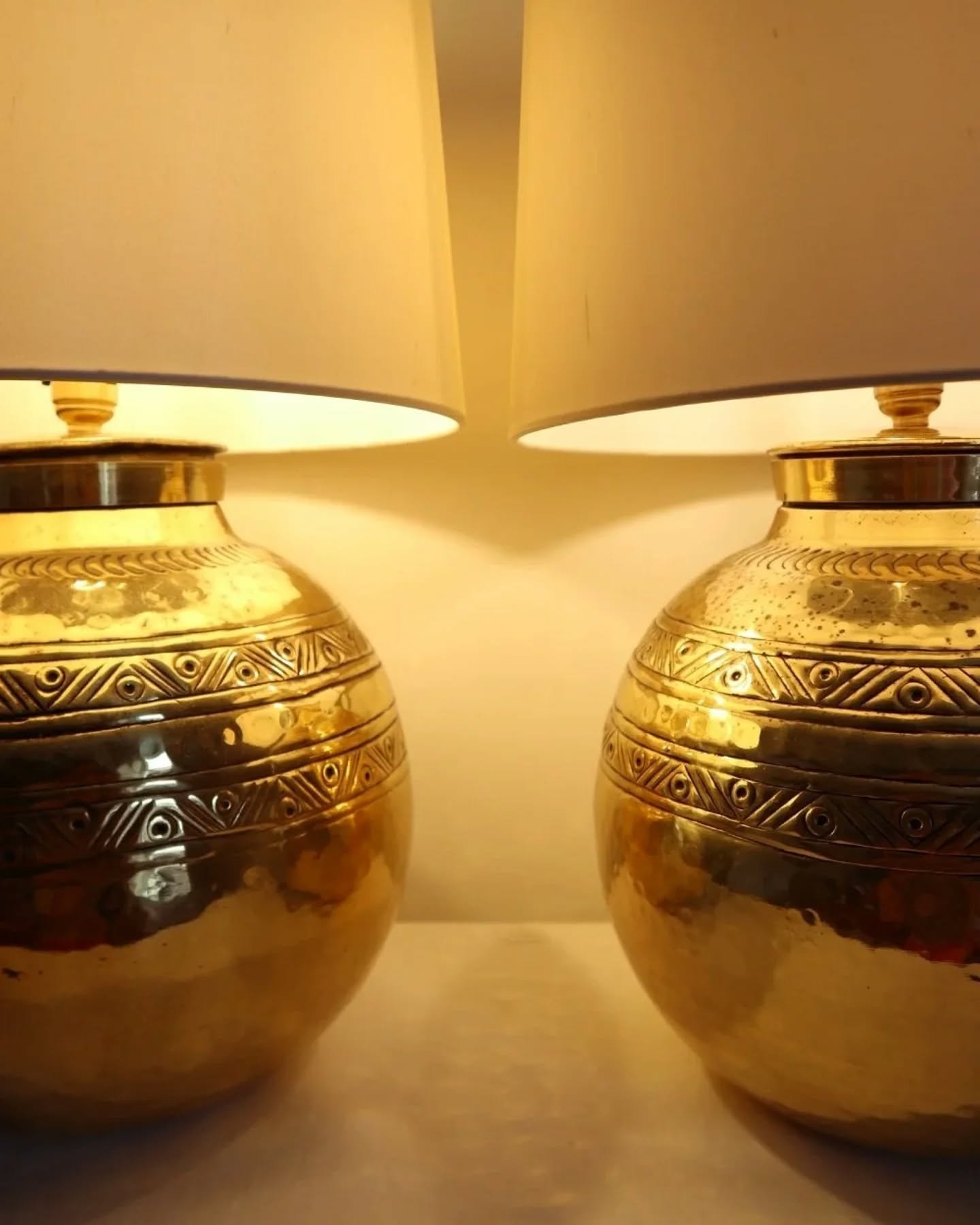 Now online ~ Pair of large, vintage beaten brass spherical table lamps with etched decoration. 

Come with new, white silk slightly tapered lampshades. 

Rewired and PAT tested. 

In good vintage condition with visible tarnishing and some light wear.