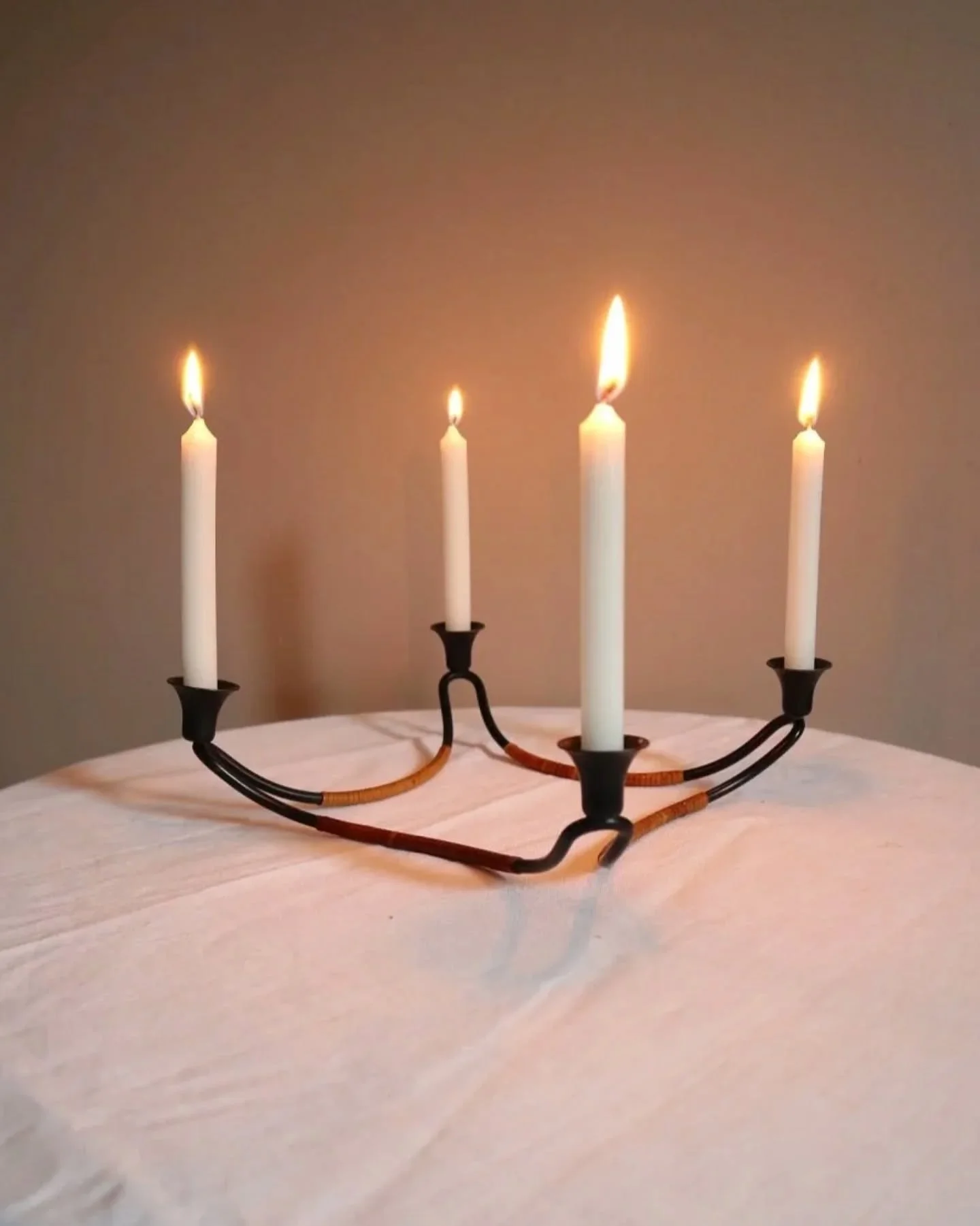 Online now ~ Modernist Danish iron and woven rattan four candle holder designed by Laurids L&oslash;nborg. Circa 1950s.

In fantastic vintage condition. 

Candles not included. Fits 1cm candles. 

H6.5cm / L20cm / D20cm