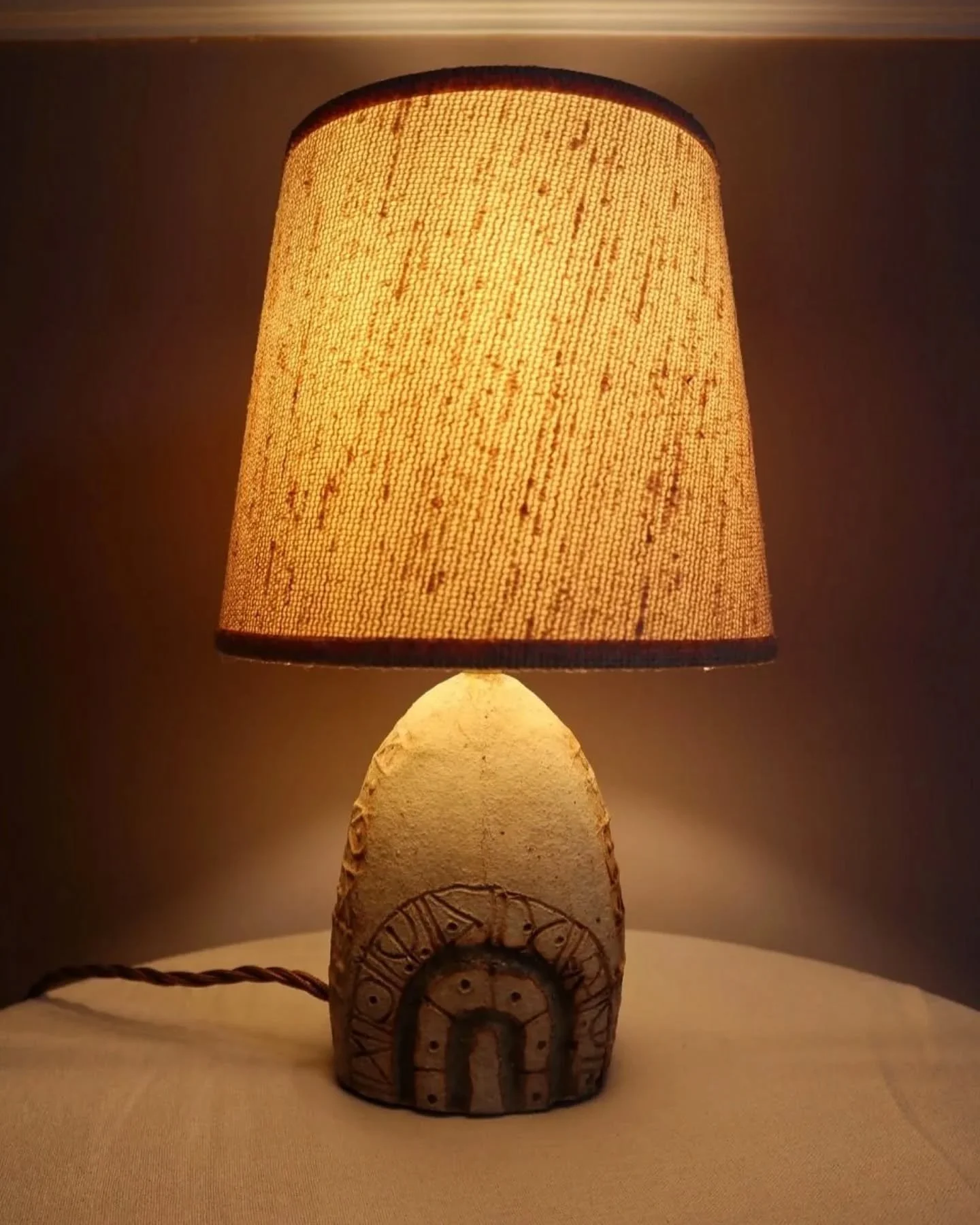 New to Peach ~ Small Brutalist stoneware table lamp by British potter Bernard Rooke. With stamped, rune-like impressions. Circa 1970s. 

Marked ROOKE.

In fantastic condition.  Rewired and PAT Tested with new felt base. 

Sold with vintage textured f