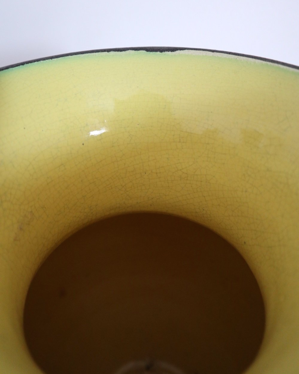 Large glossy, metallic black vase with double twisted handles and contrasting, yellow crackled glaze interior. Typical of Elchinger productions, France. Circa 1950s