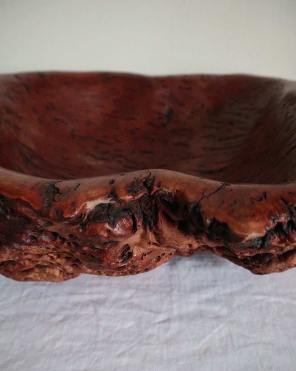 Large Australian hand carved red gum burl wood centrepiece bowl with polished centre and organic naturalistic outside. Signed 'M Bailey' and original Merv Bailey sticker to base.