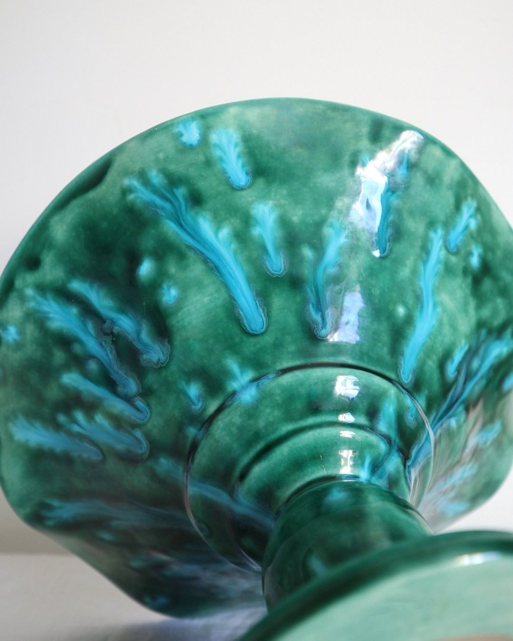 Studio pottery vibrant blue green shiny drip glaze pedestal cake stand / dish with wavy edge.