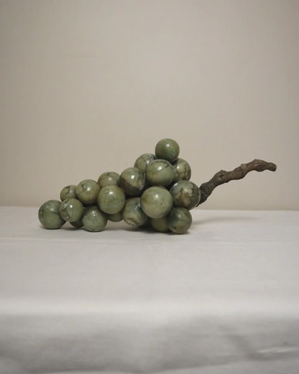 Large 1970s cluster of green alabaster grapes with real vine stem.