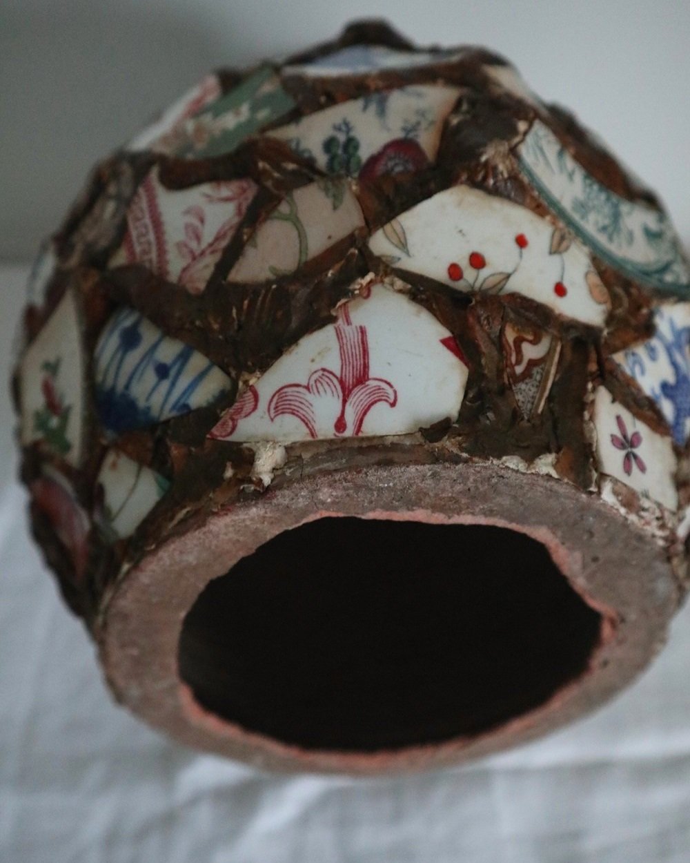 Large French pique assiette mosaic pottery jug with handle.