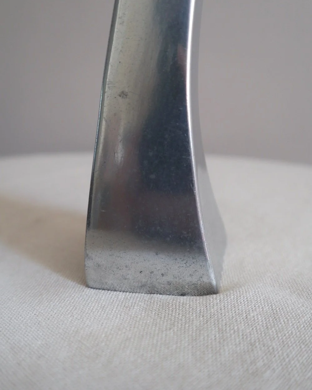 Pair of tall, elegant 1980s Modernist cast aluminium candleholders, likely 'Nessie' style designed by Matthew Hilton.