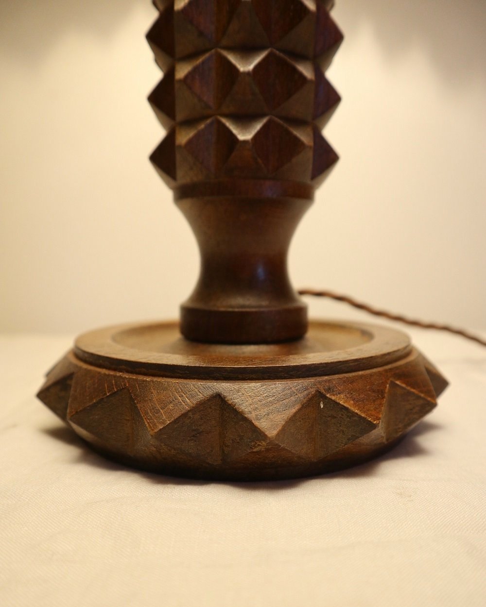 French Charles Dudouyt style carved wooden Brutalist table lamp with new, white pleated lampshade.
