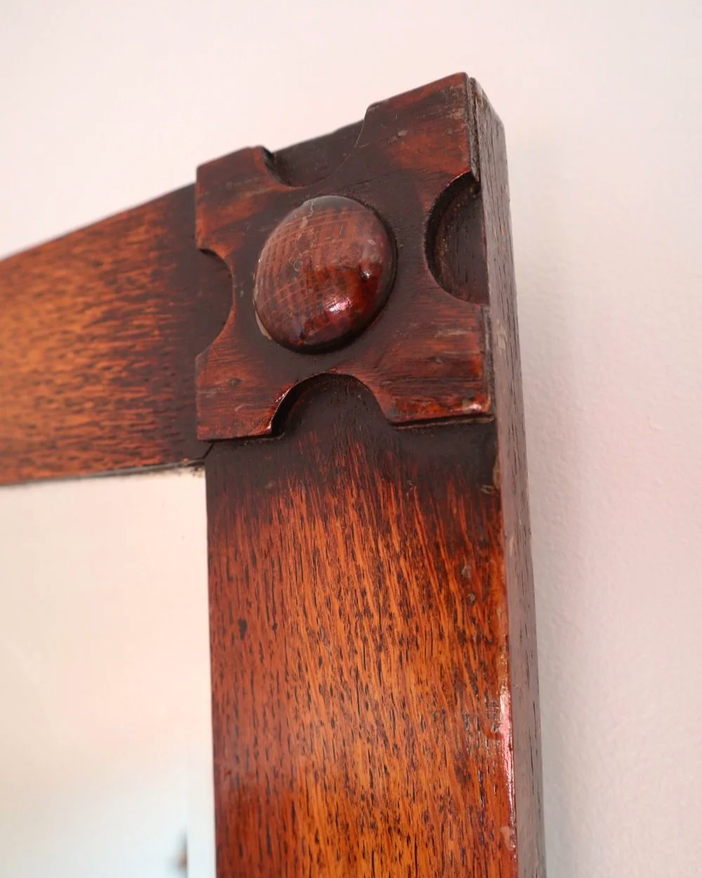 Arts & Crafts square wooden framed mirror with carved corner detailing. Circa 1930s.