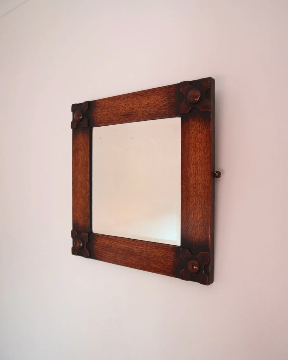 Arts & Crafts square wooden framed mirror with carved corner detailing. Circa 1930s.