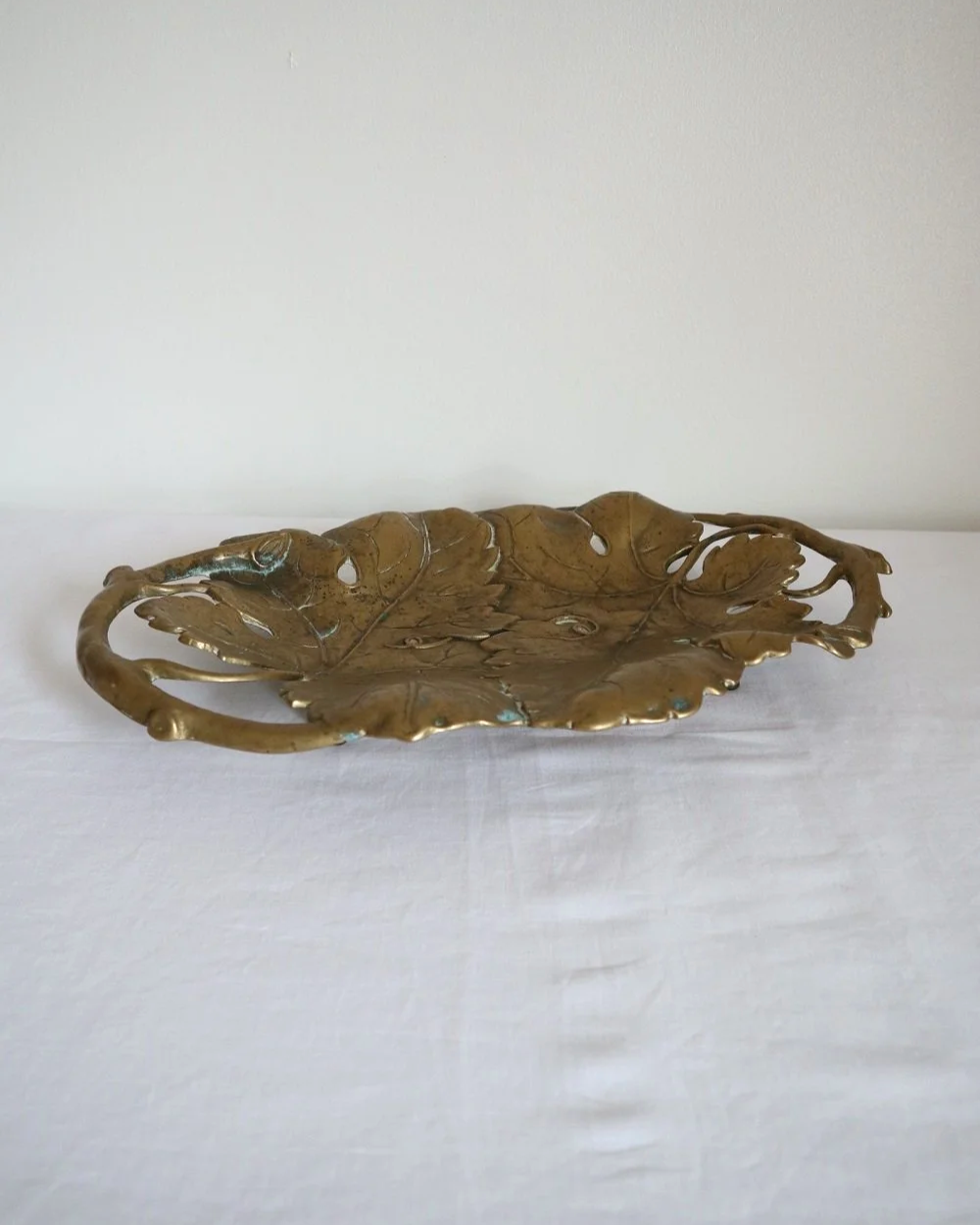 Vintage solid brass decorative Art Nouveau dish of intertwined grapevine leaves, circa 1960s.
