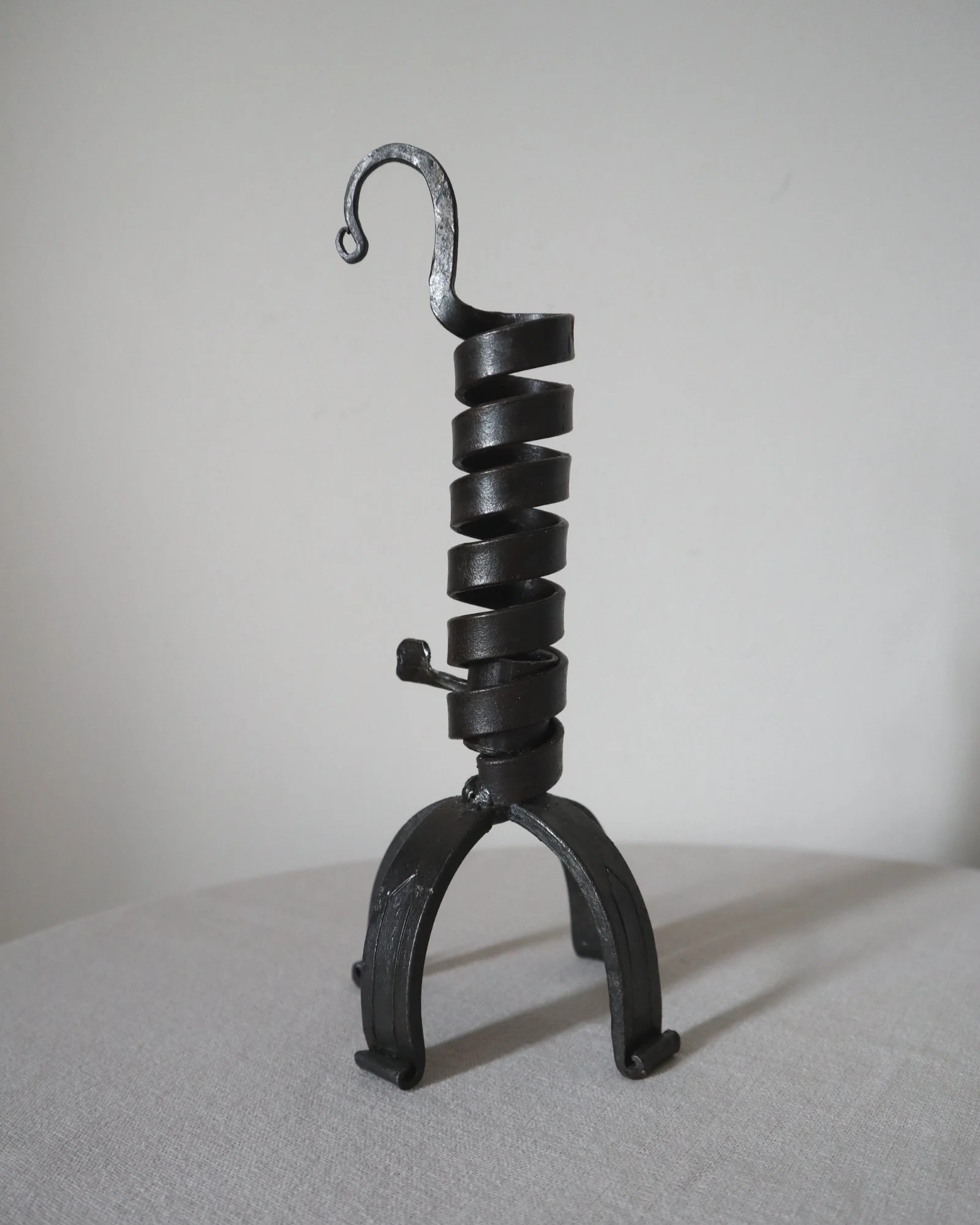 Vintage wrought iron ‘rat de cave’ style candleholder with turning spiral mechanism which raises the candle as it burns lower.