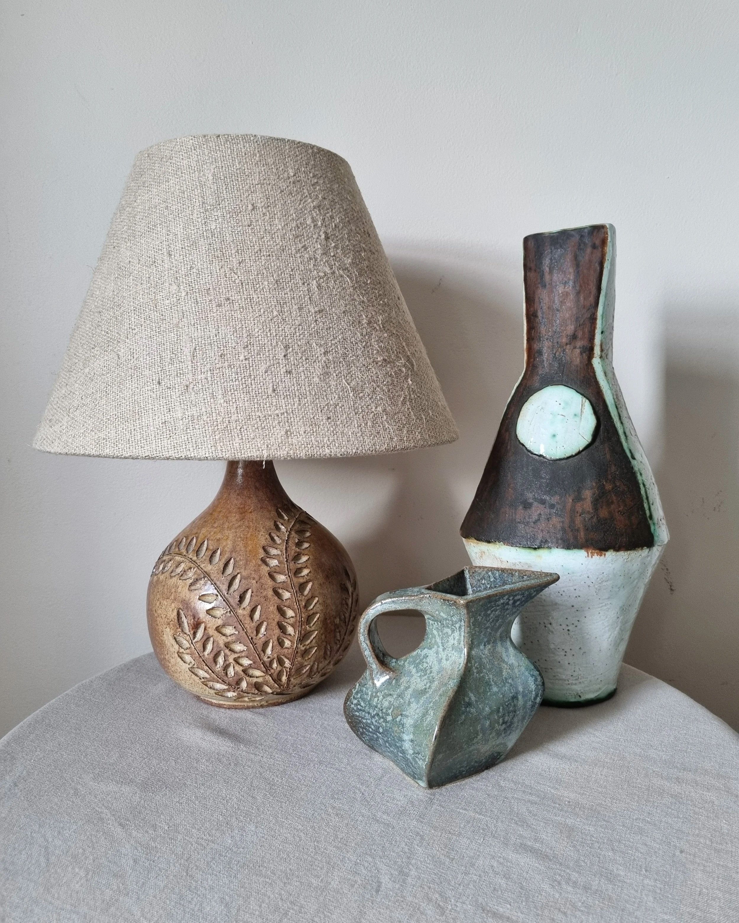 Small studio pottery sculptural angular ceramic jug with grey blue speckled glaze.   Signed A W to base.