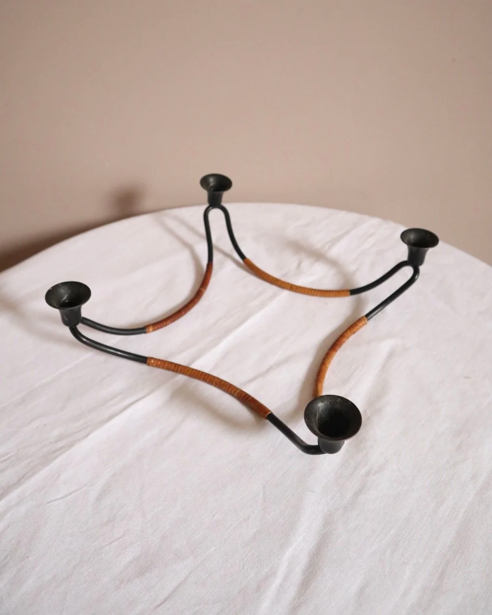 Modernist Danish iron and woven rattan four candle holder designed by Laurids Lønborg. Circa 1950s.