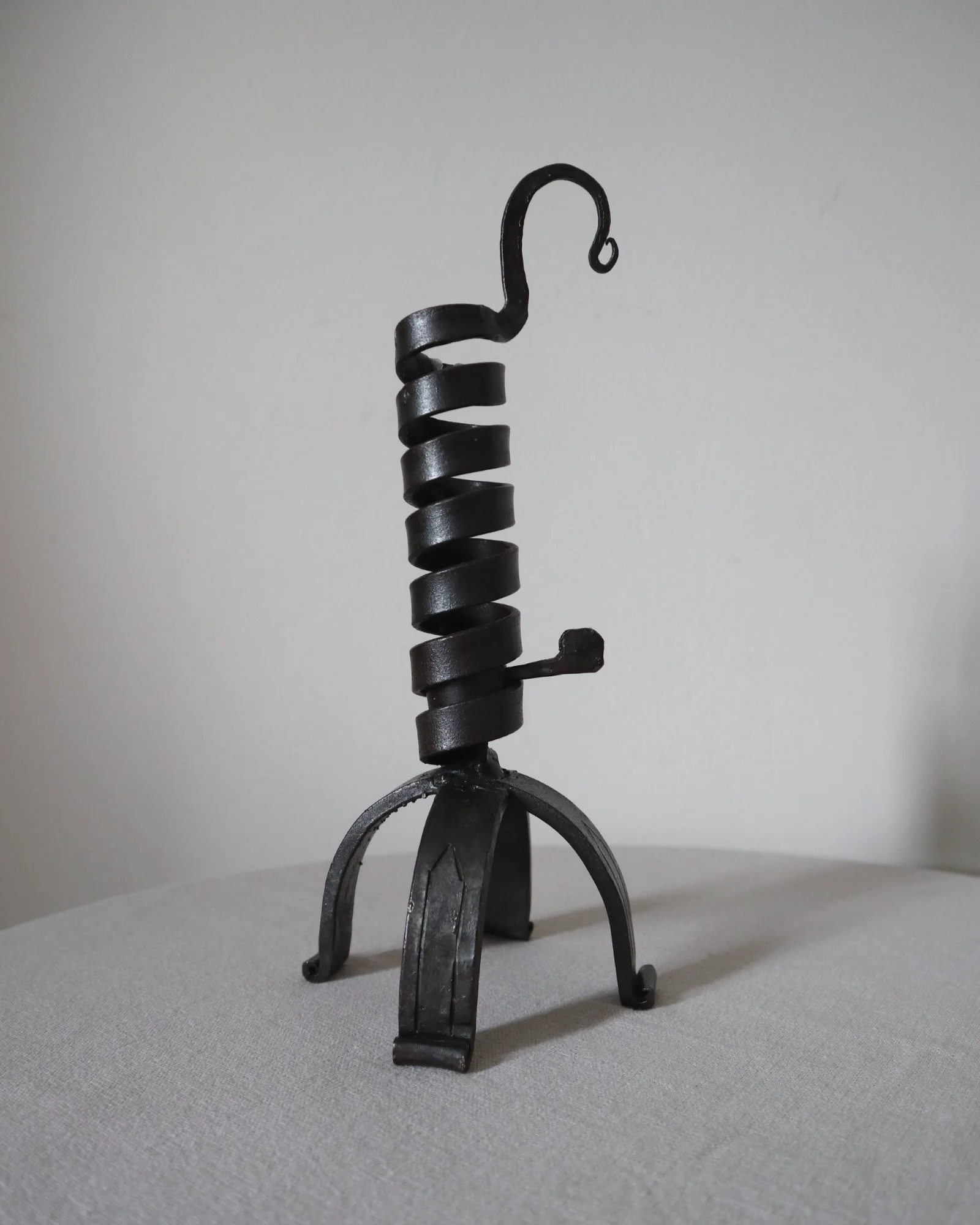 Vintage wrought iron ‘rat de cave’ style candleholder with turning spiral mechanism which raises the candle as it burns lower.