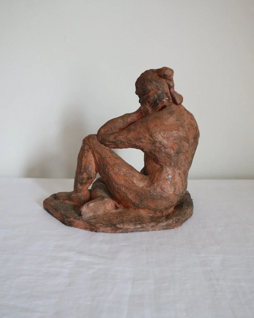 Heavy handmade studio pottery textured sculpture of seated nude woman.