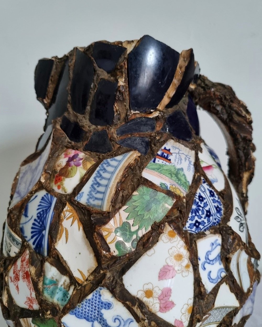 Large French pique assiette mosaic pottery jug with handle.