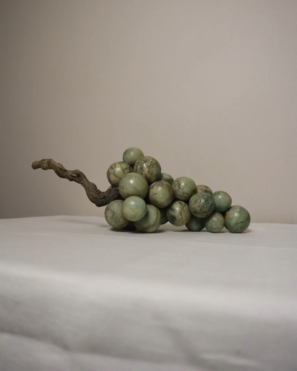 Large 1970s cluster of green alabaster grapes with real vine stem.