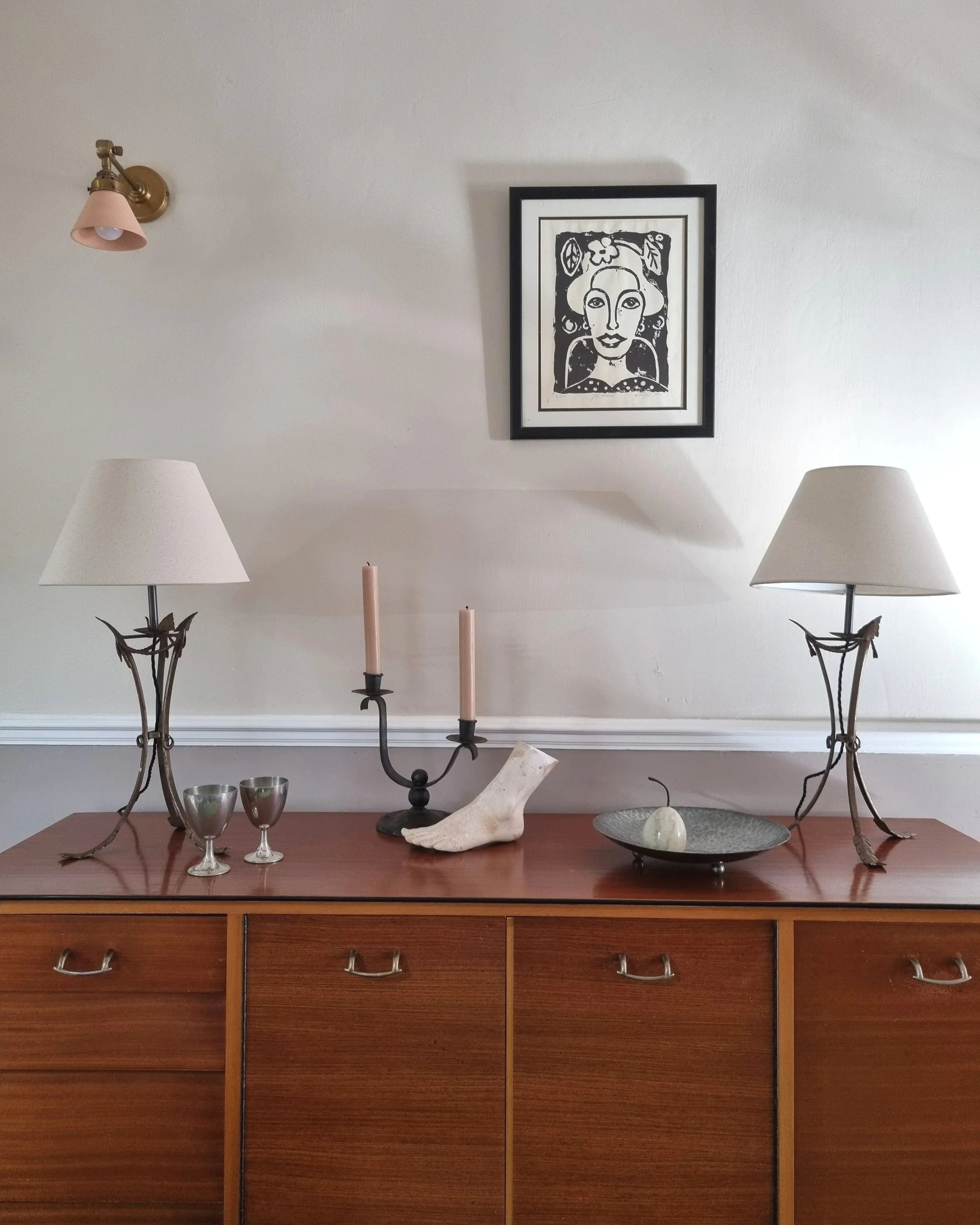 Pair of French style mid century metal tripod table lamps featuring three arrows.