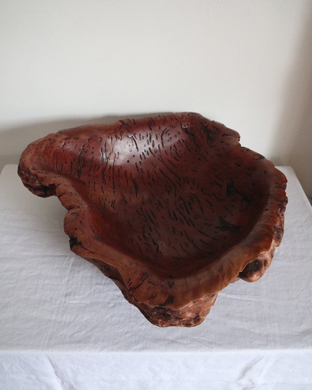 Large Australian hand carved red gum burl wood centrepiece bowl with polished centre and organic naturalistic outside. Signed 'M Bailey' and original Merv Bailey sticker to base.