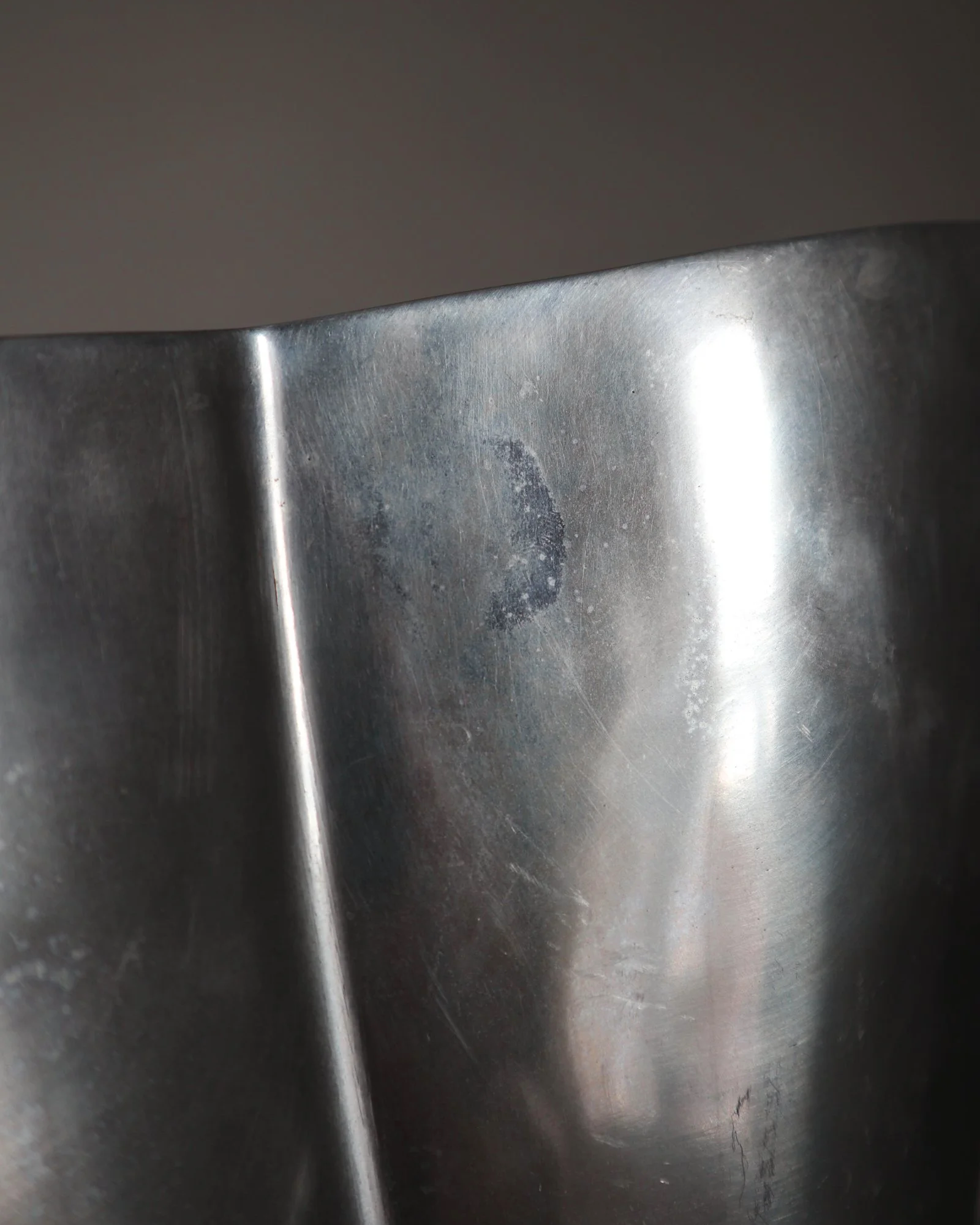 Postmodern heavy cast aluminium vase with sculptural form and four small inset stones. In the style of Anna Efverlund. Circa 1980s. Unsigned.