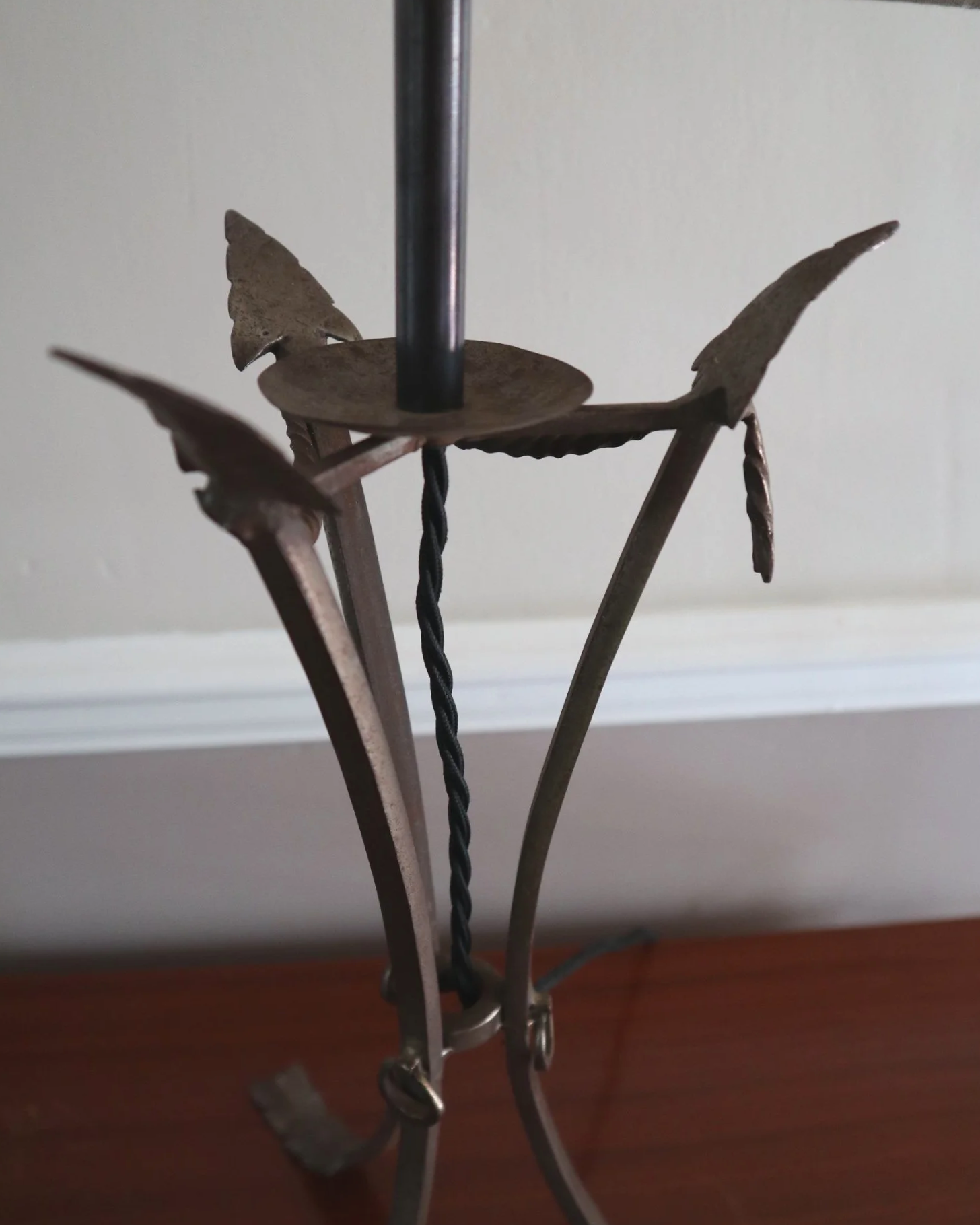 Pair of French style mid century metal tripod table lamps featuring three arrows.