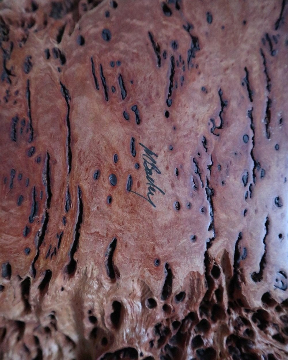 Large Australian hand carved red gum burl wood centrepiece bowl with polished centre and organic naturalistic outside. Signed 'M Bailey' and original Merv Bailey sticker to base.