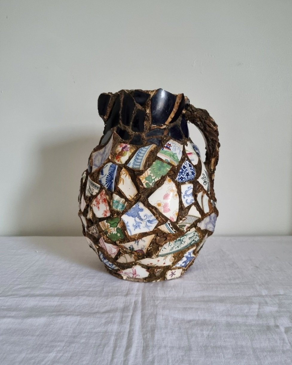 Large French pique assiette mosaic pottery jug with handle.