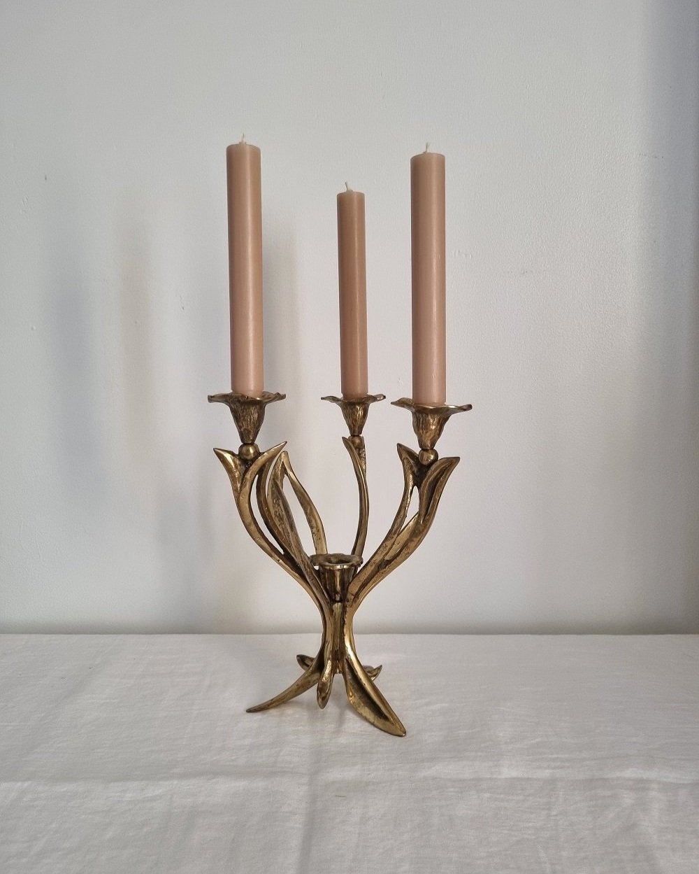 Mid century Art Nouveau style floral heavy brass candelabra with three arms and central candleholder. Circa 1970s.