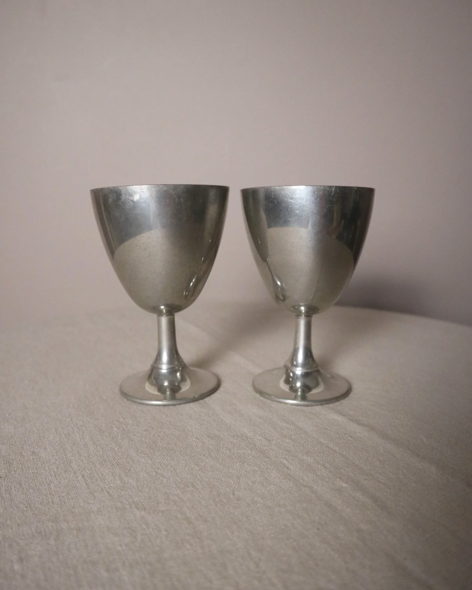 Pair of British P.H. Vogel & Co pewter goblets. Made in England. Circa 1970s.