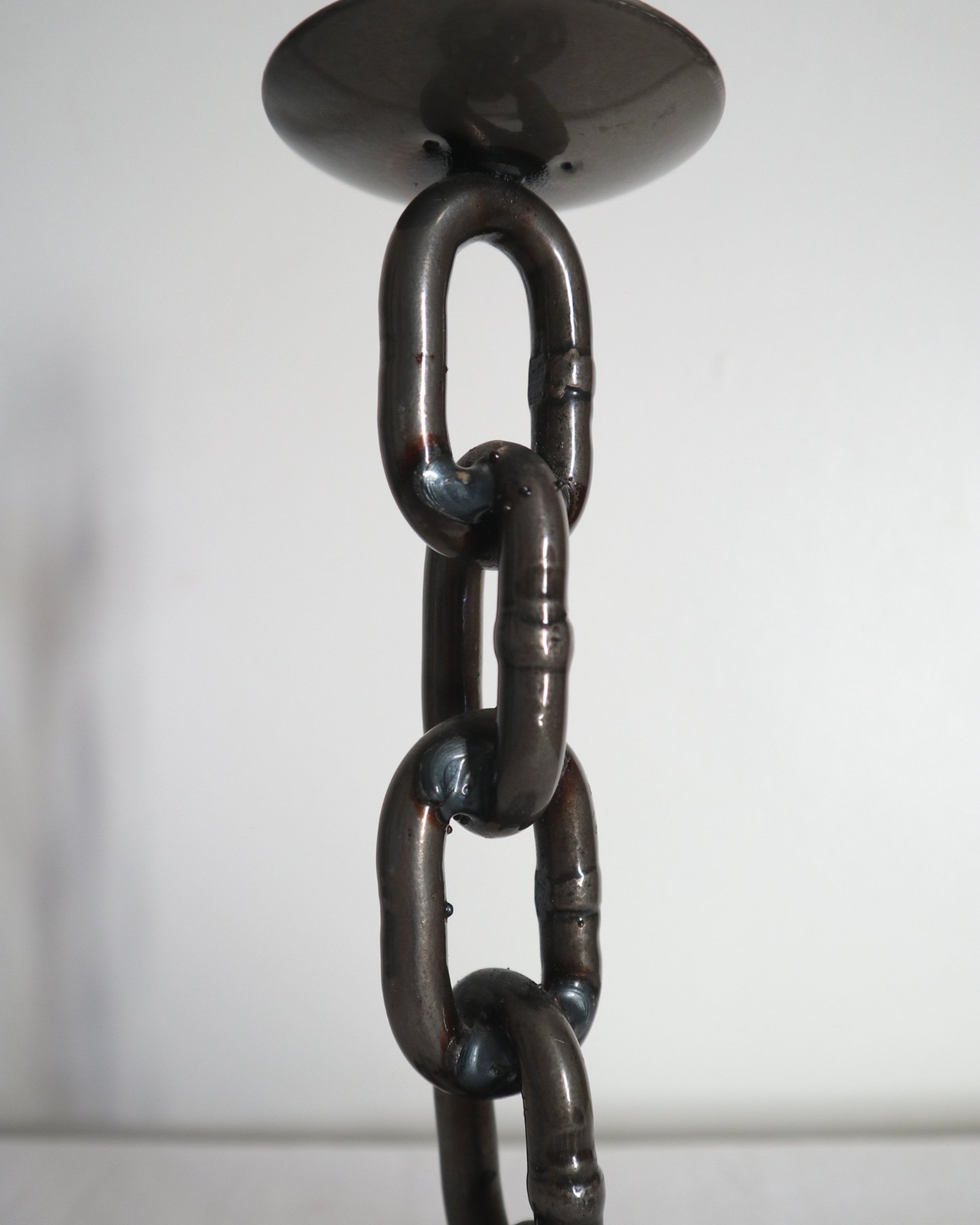 Heavy, vintage Brutalist chain link candlestick made from lacquered grey forged iron.