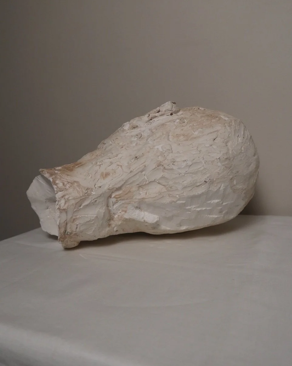 Large, heavy off white textured plaster sculpture of man's head in abstract style. Unknown age.