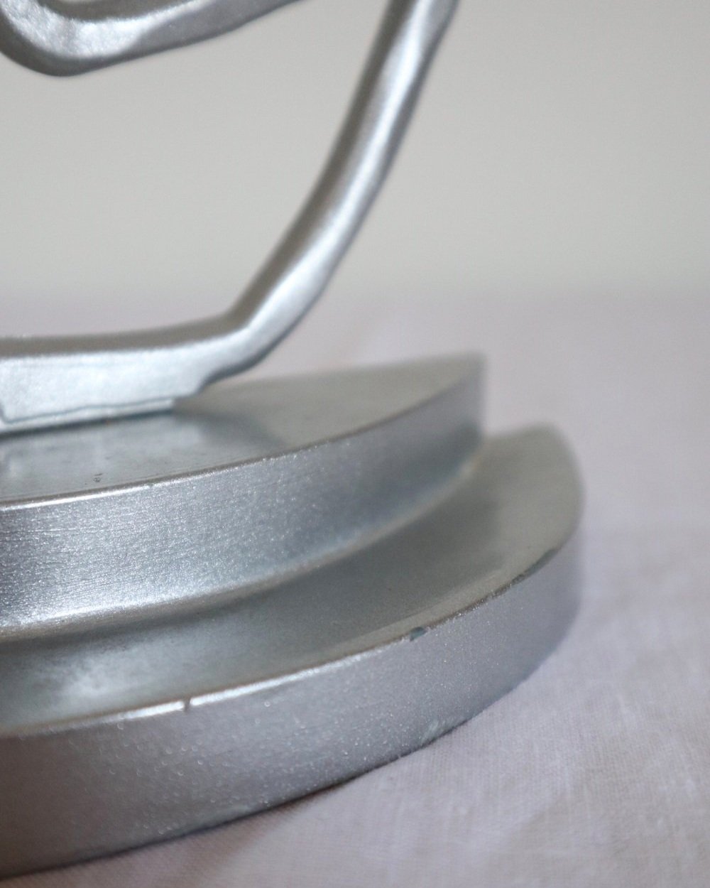 Pair of Postmodern sprayed silver spiral bookends, circa 1990s.