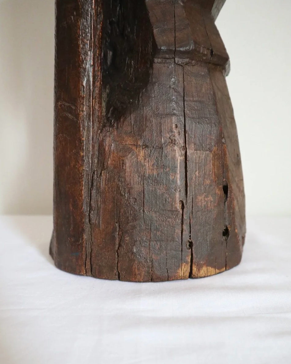Heavy primitive sculptural carved wooden mortar with handle.