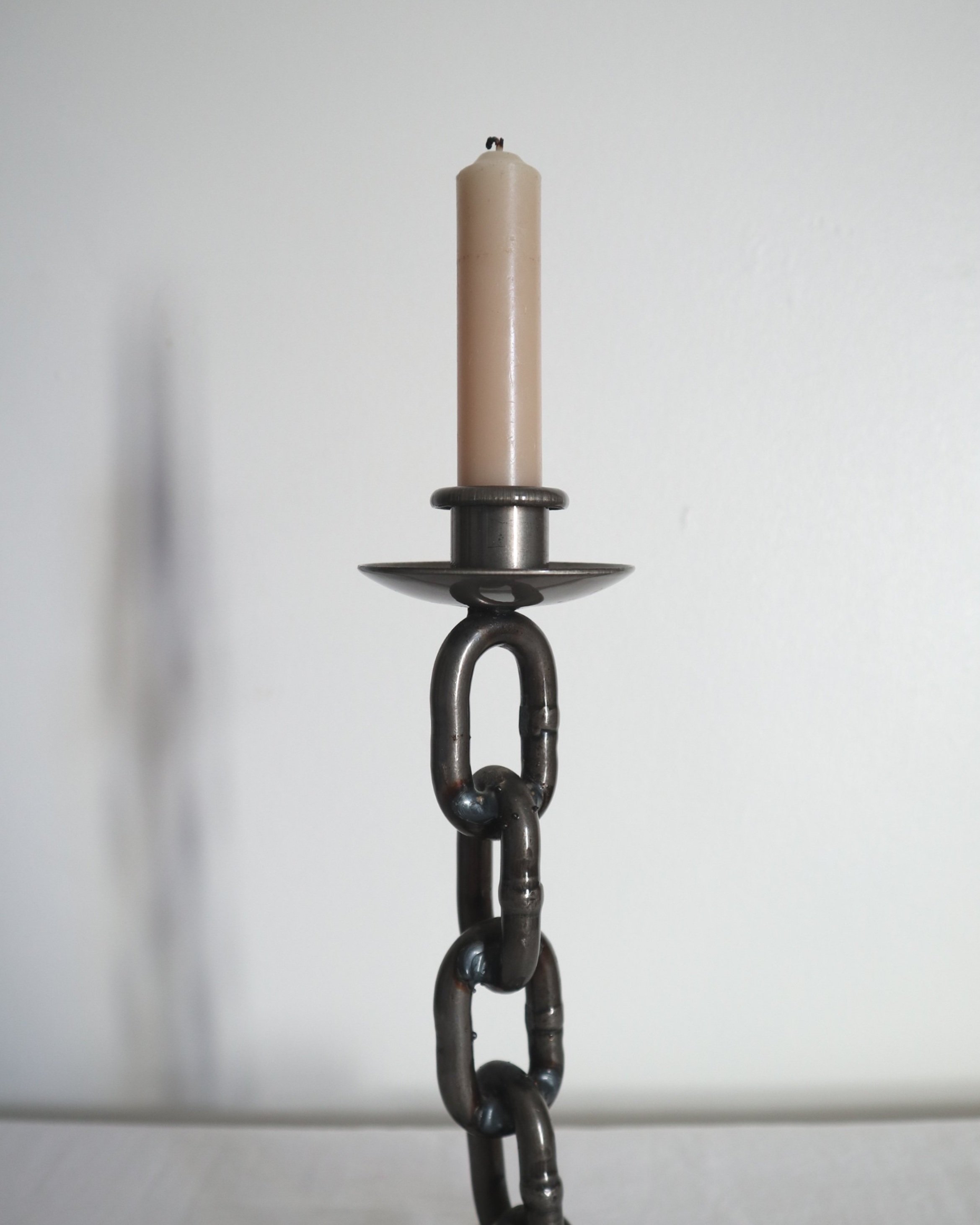 Heavy, vintage Brutalist chain link candlestick made from lacquered grey forged iron.
