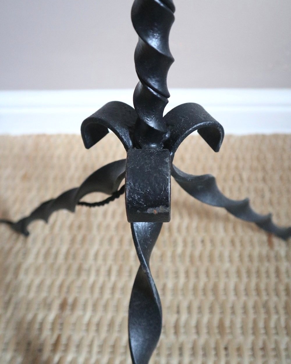 French wrought iron floor lamp with twisted corkscrew column and tripod base. Circa 1950s.