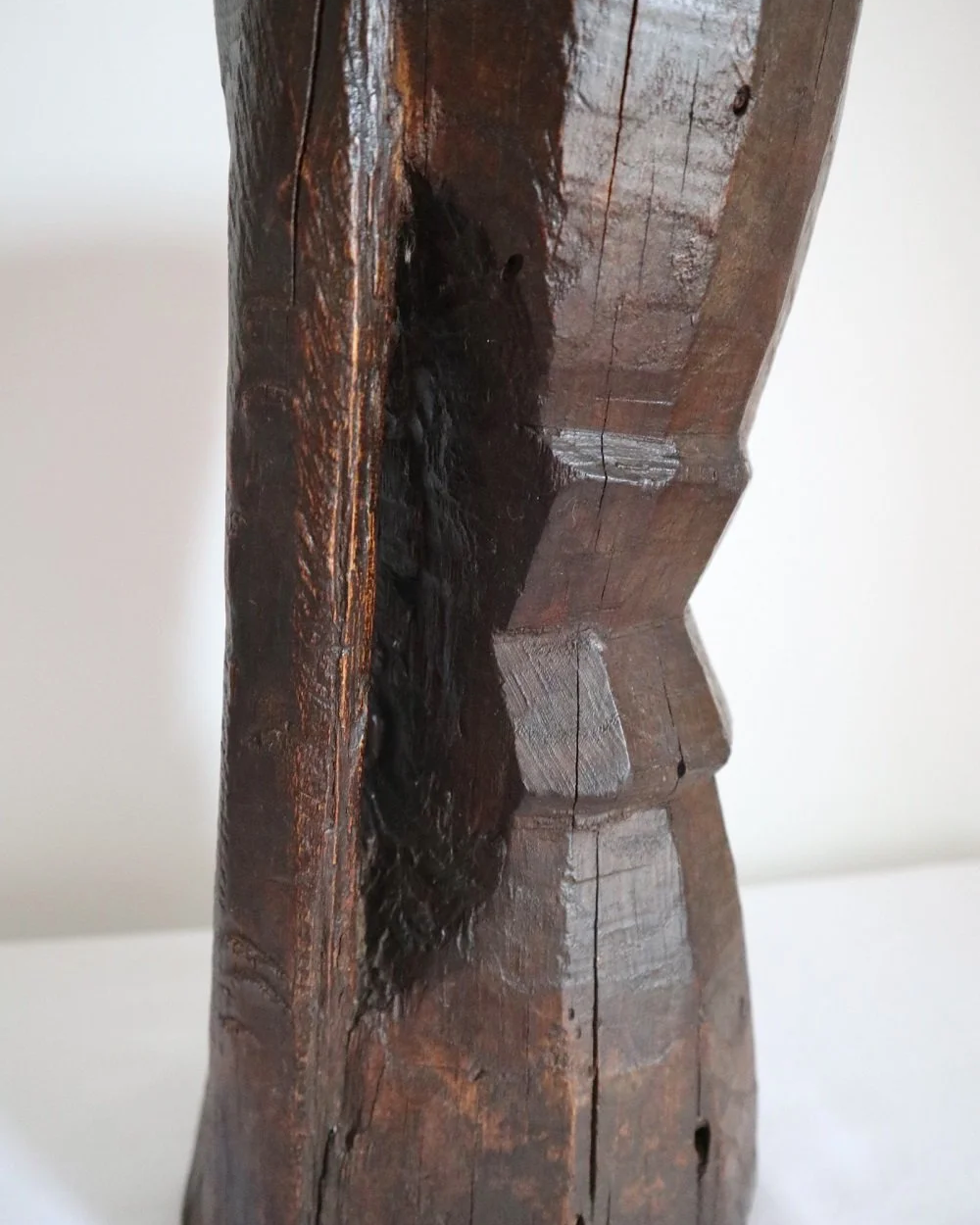 Heavy primitive sculptural carved wooden mortar with handle.