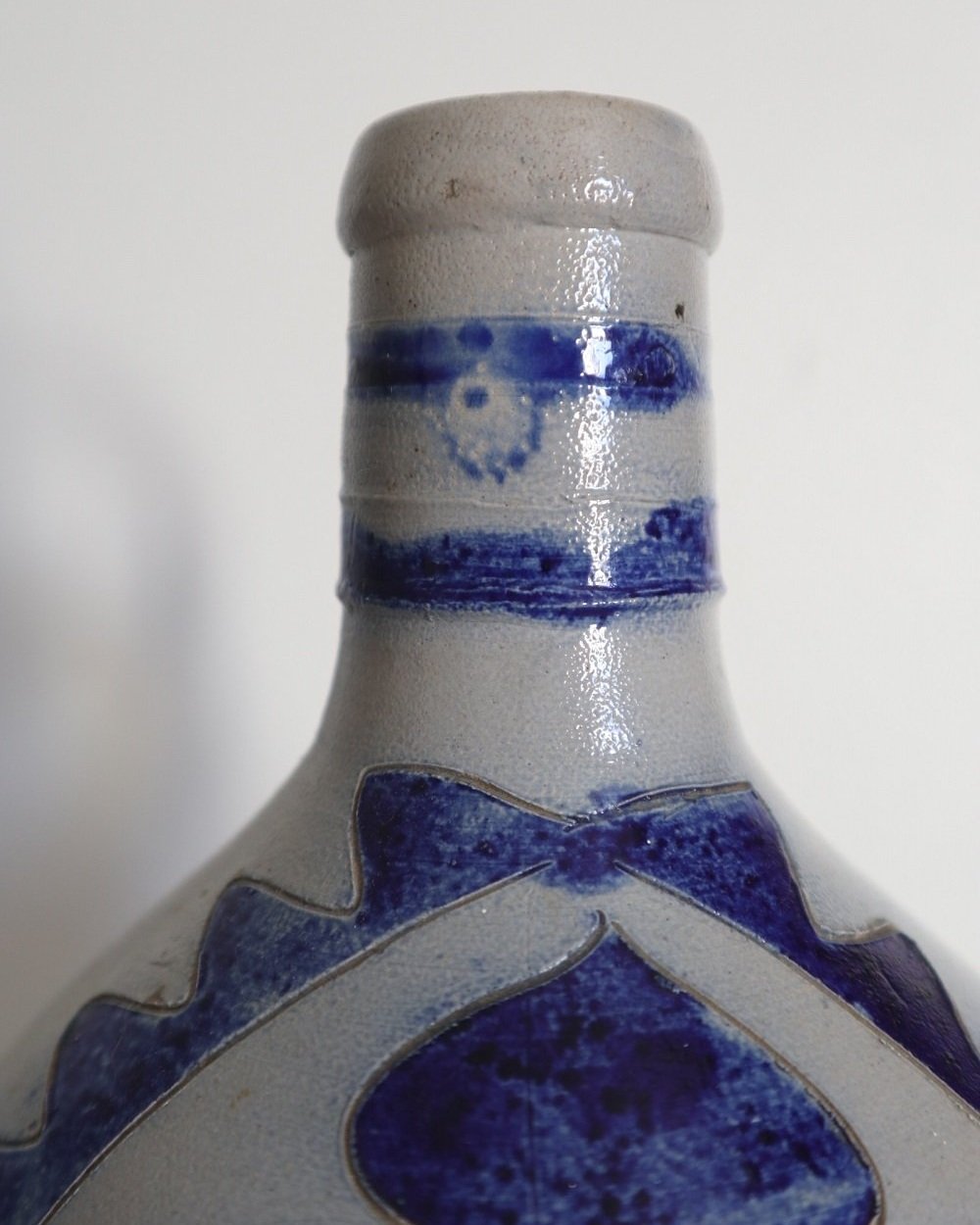Large vintage German Westerwald salt glazed stoneware flagon with cobalt blue foliage decoration and two bands to the neck.