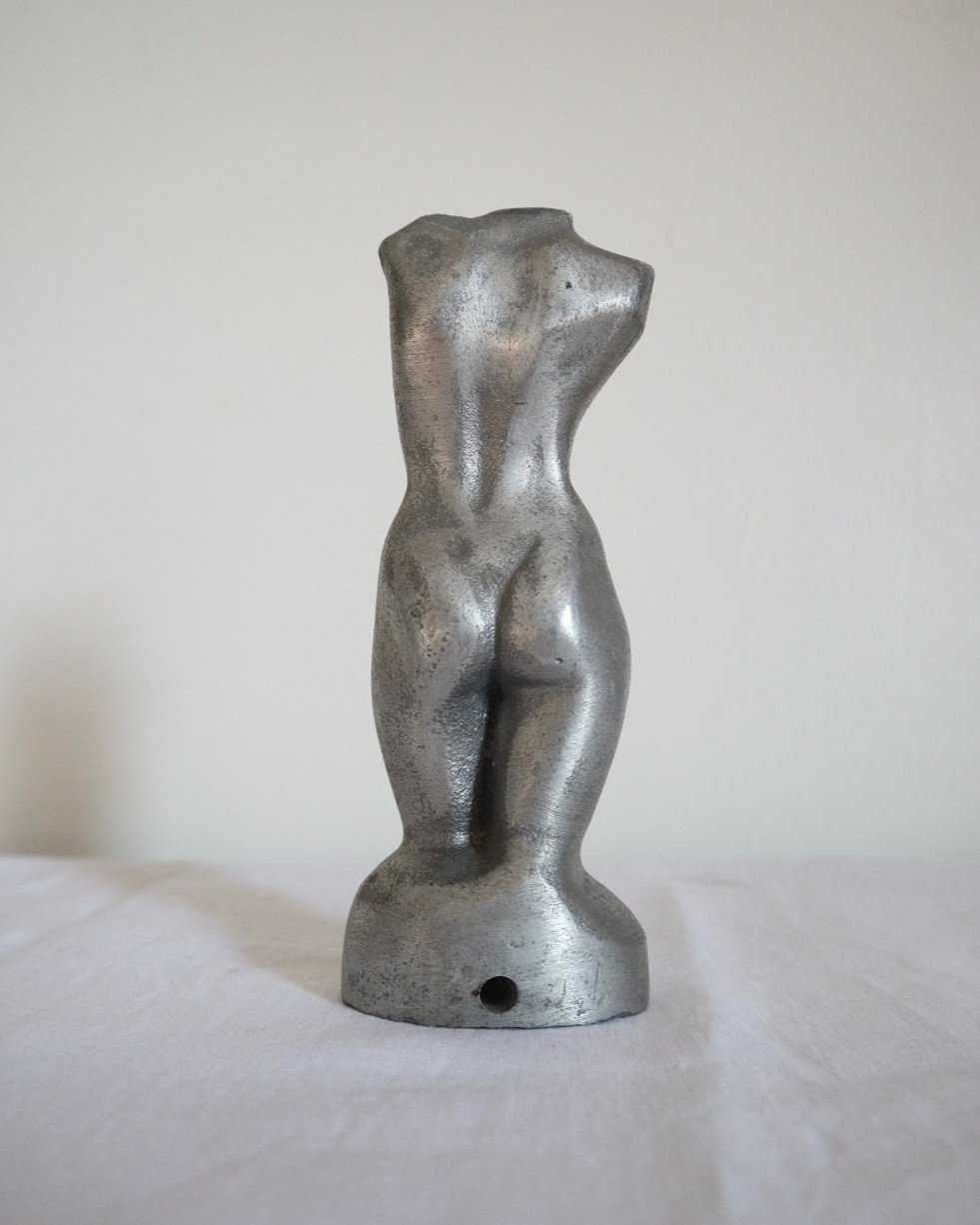 Modernist cast aluminium naked torso sculpture.