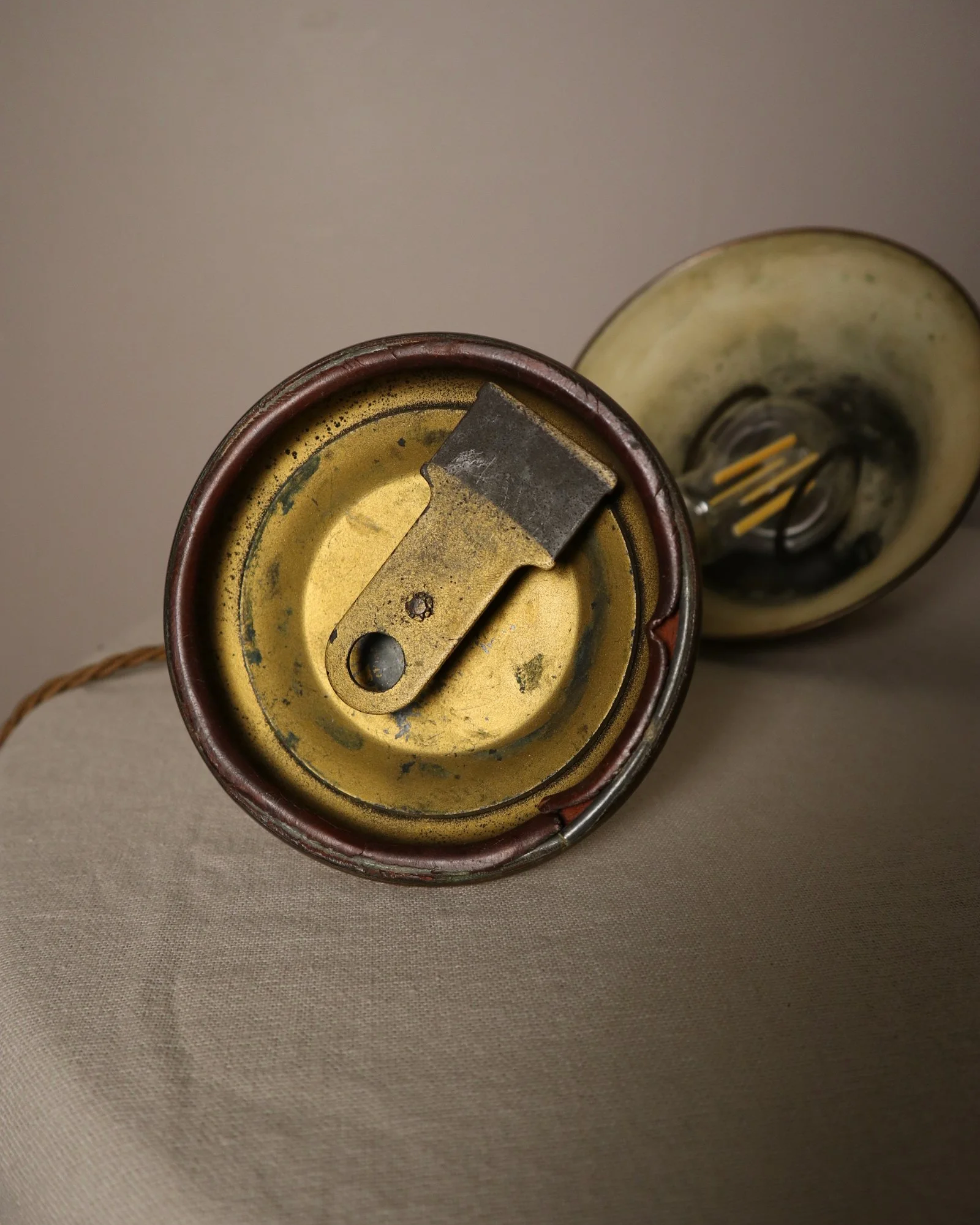 Small, vintage adjustable brass worker's desk lamp. Can be freestanding or attached to the edge of a workbench etc with clamp.