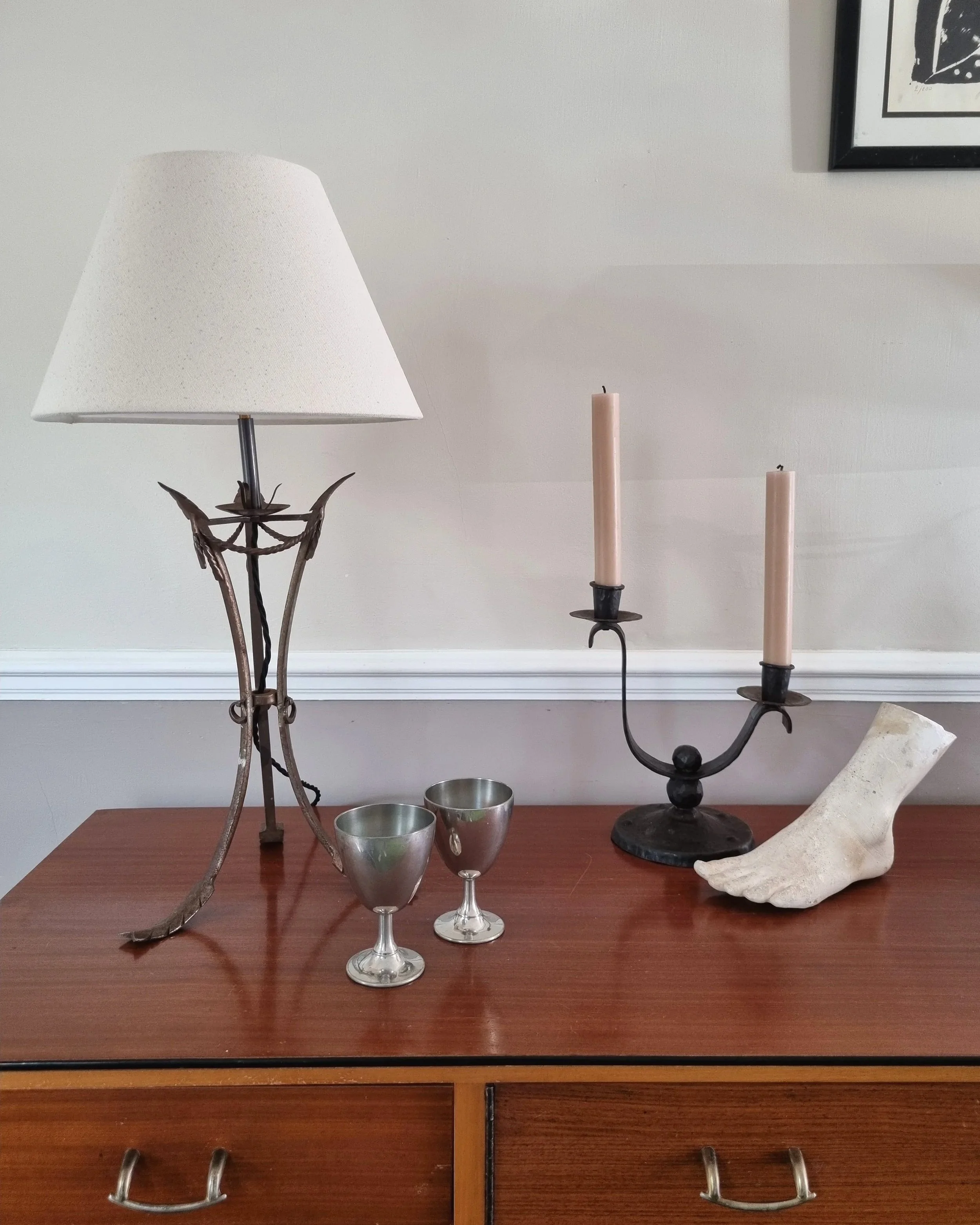 Pair of French style mid century metal tripod table lamps featuring three arrows.