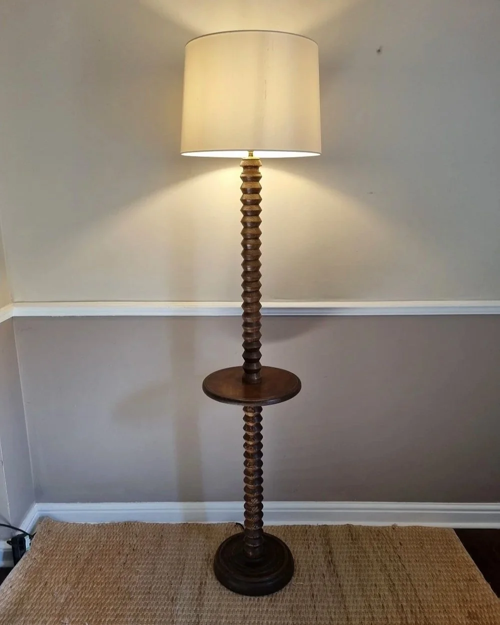 French, tall carved wooden Brutalist floor lamp with shelf platform in the manner of Charles Dudouyt, circa 1940s.