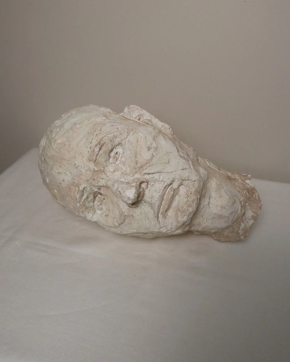 Large, heavy off white textured plaster sculpture of man's head in abstract style. Unknown age.