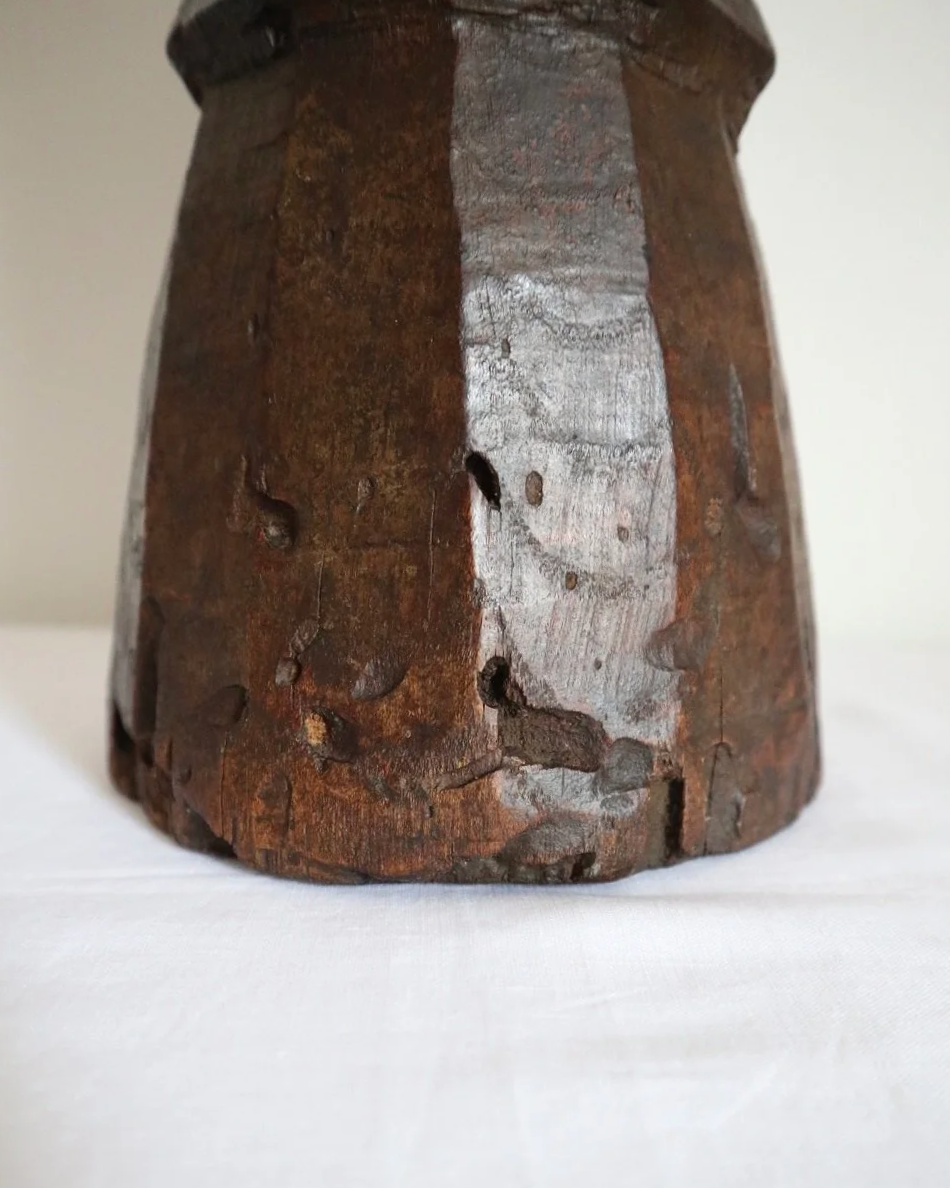 Heavy primitive sculptural carved wooden mortar with handle.