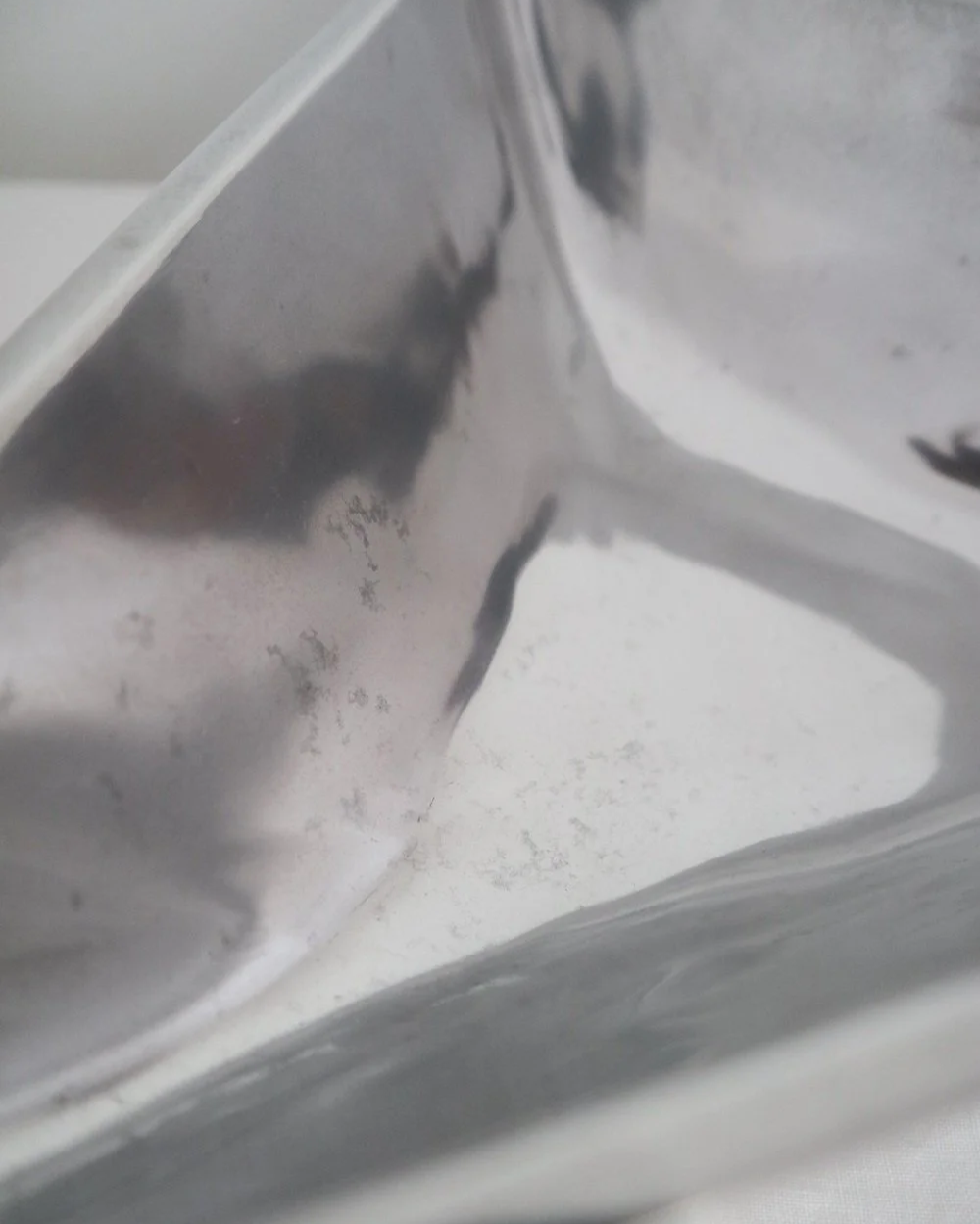 Solid shiny aluminium triangular Modernist style dish.