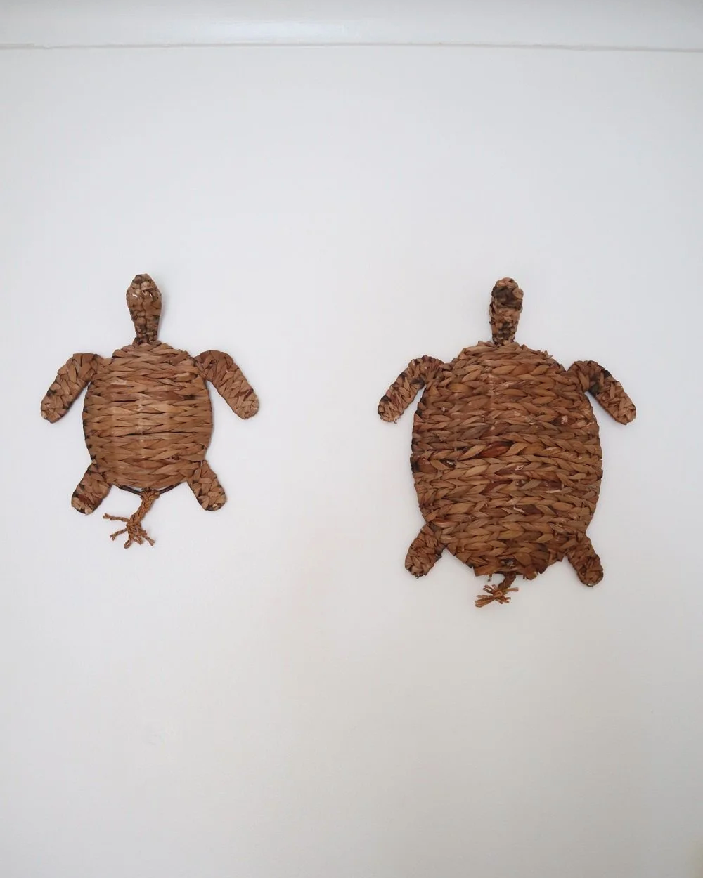 Set of two vintage turtle wall hangings handmade with woven natural water hyacinth.