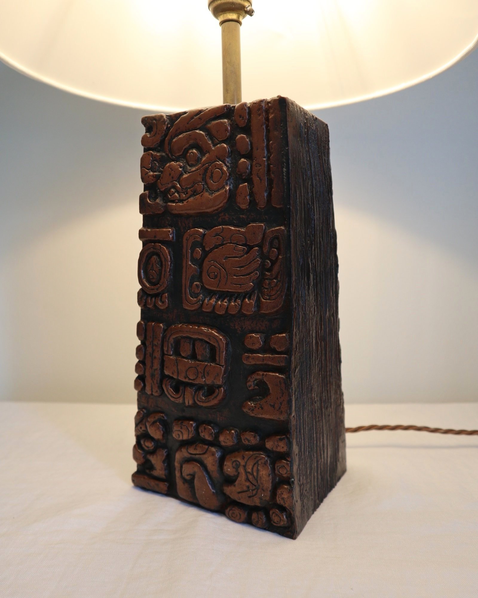 Mid century very heavy Brutalist Aztec style cast resin table lamp with metallic bronze finish.