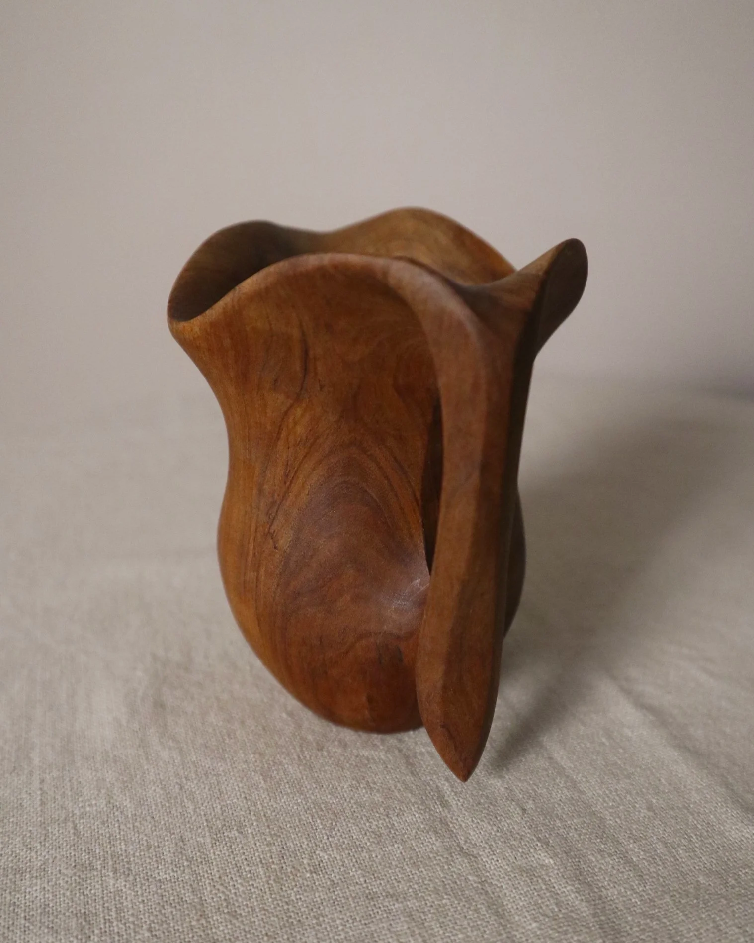 Small mid century hand carved sculptural olivewood jug in the style of Alexandre Noll. Circa 1960s.