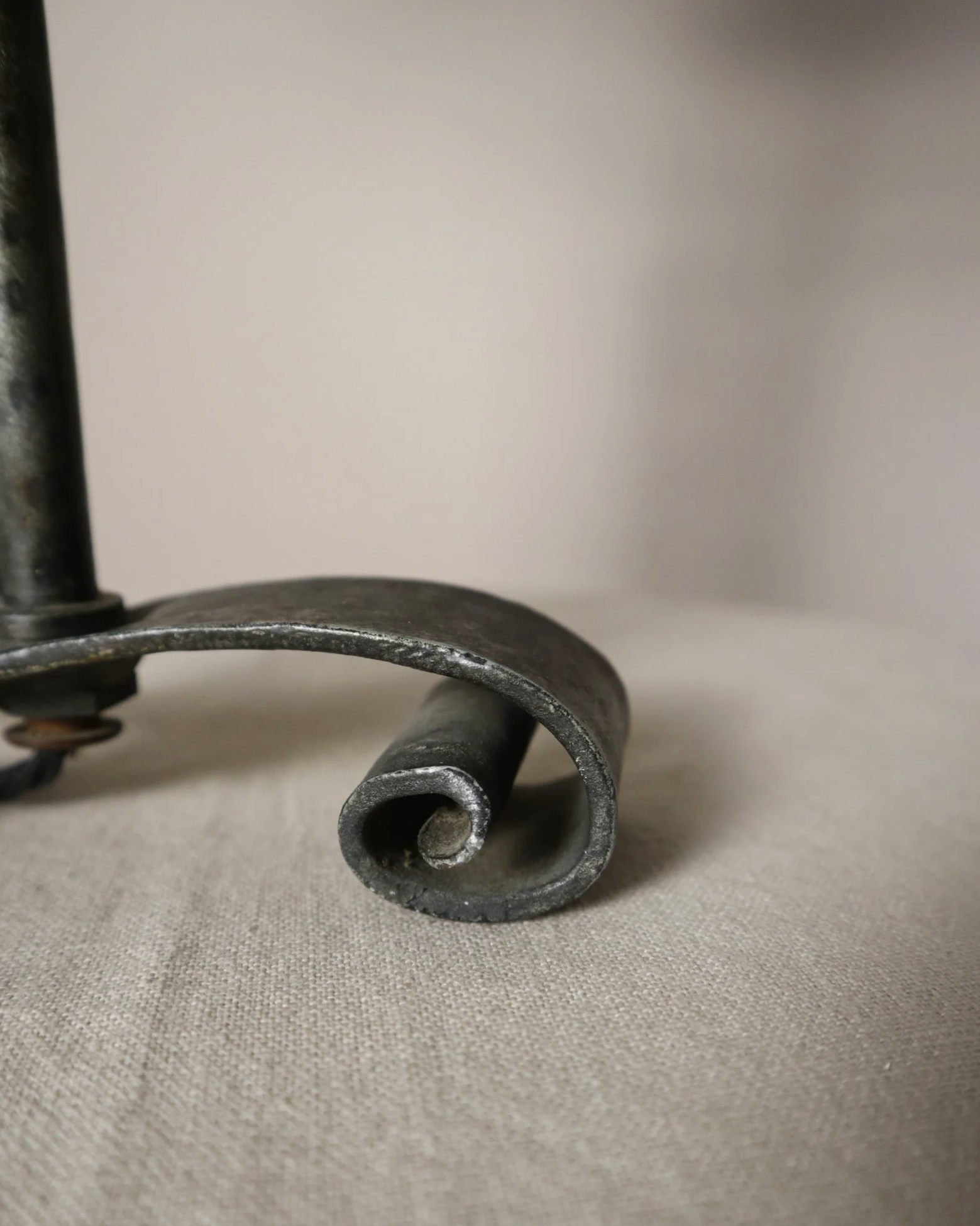 Vintage Art Deco style metal candlestick table lamp with elegant scroll detailing.