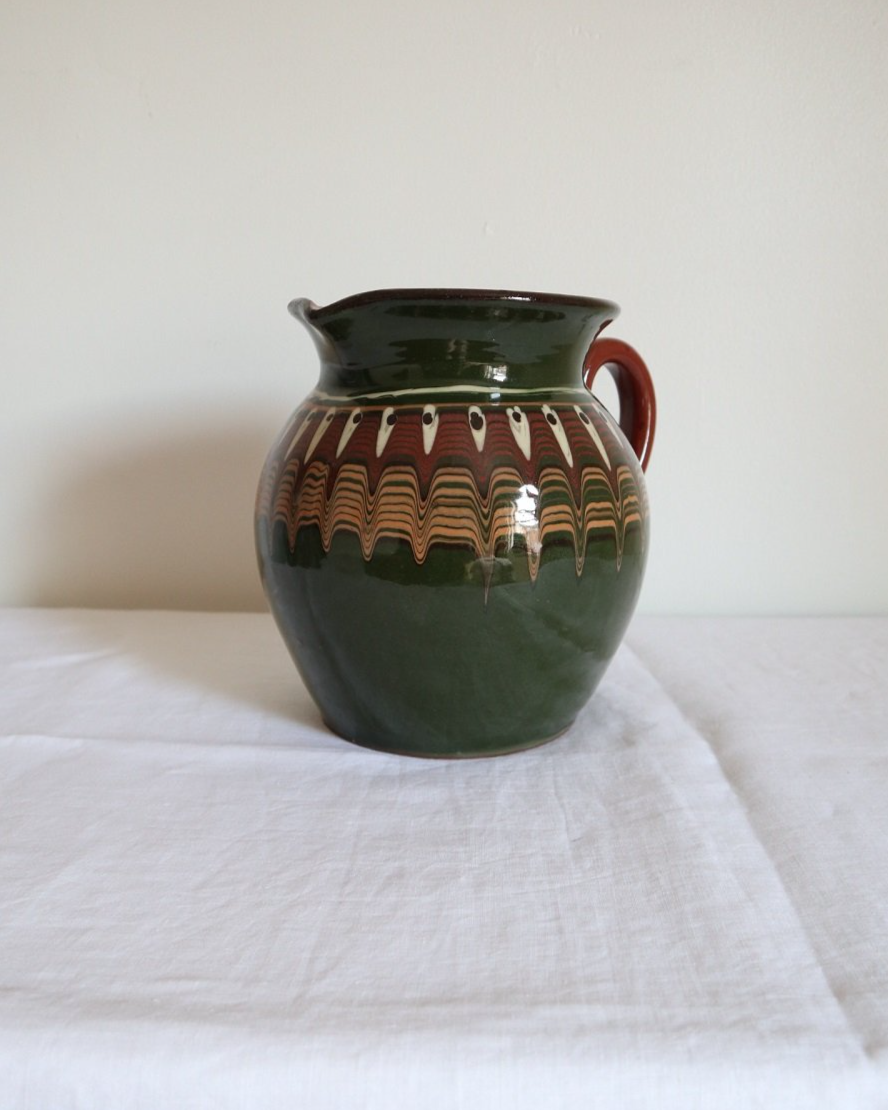 Large Bulgarian green and brown ceramic pitcher jug in traditional Troyan style.