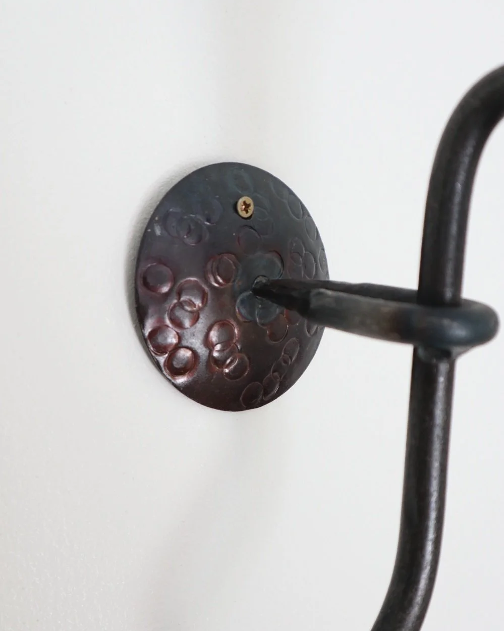 Large Swedish black iron wall sconce candleholder with wavy design. Circa 1960s.